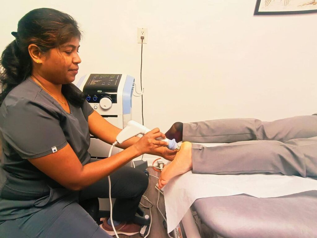Physiotherapist using Shockwave Therapy for plantar fasciitis treatment in Richmond Hill