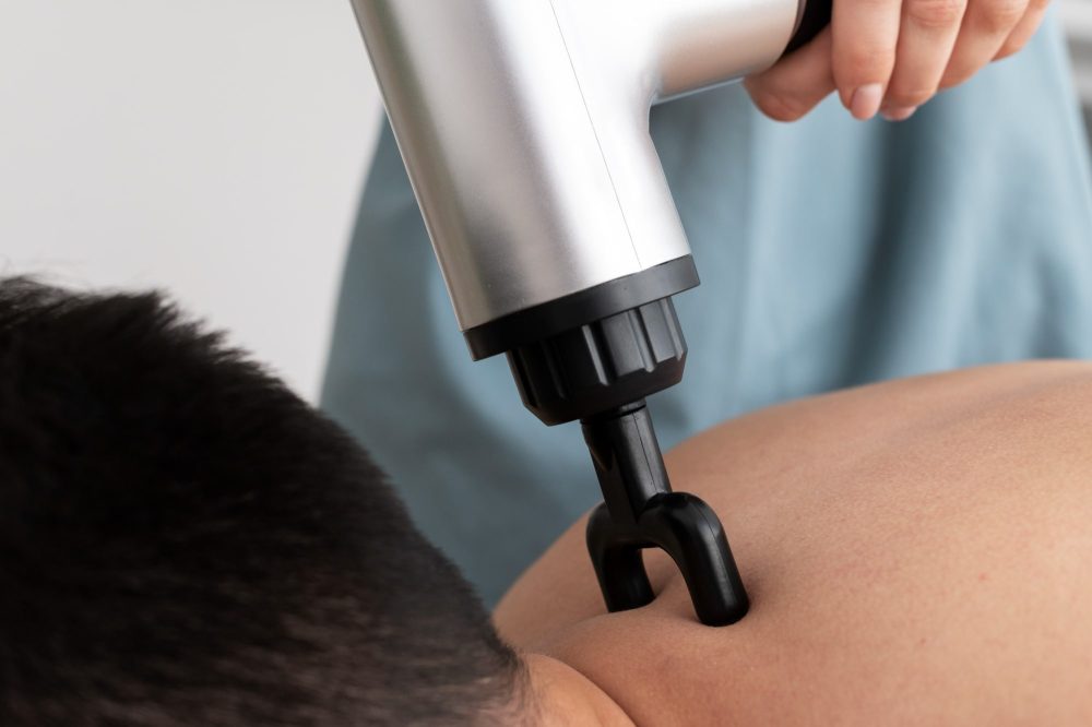 person-using-massage-gun-min person-using-massage-gun-min